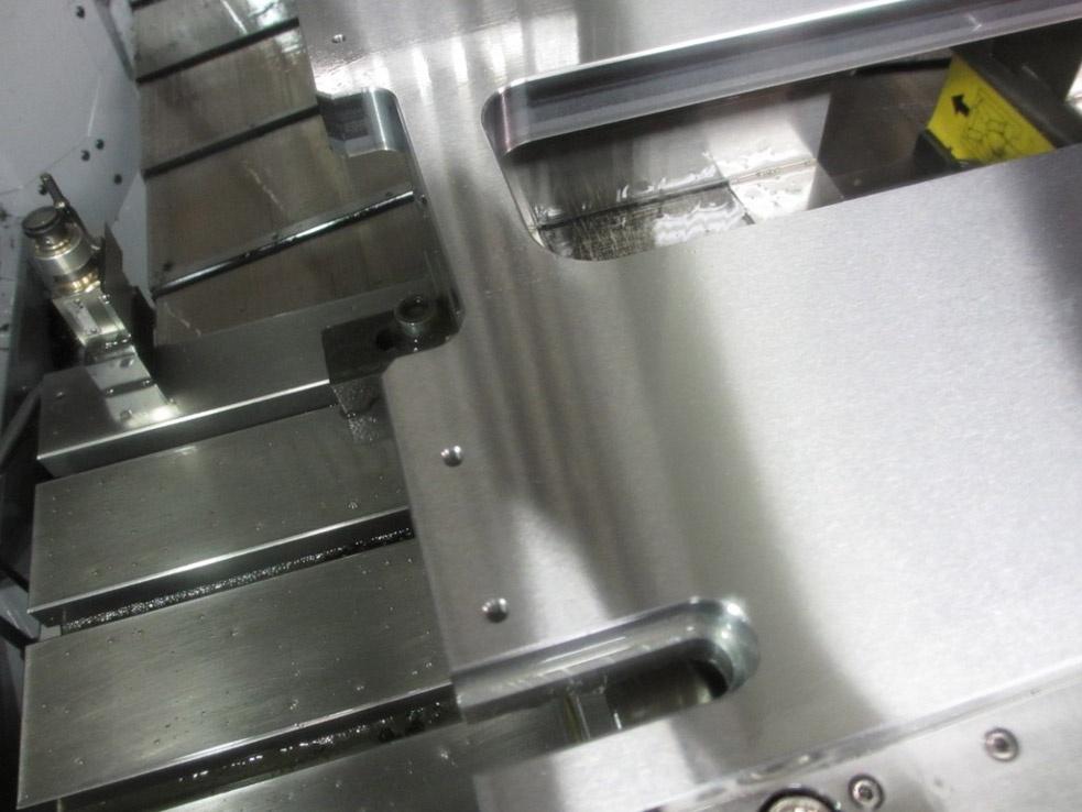 Burrless chamfering of machine tool component