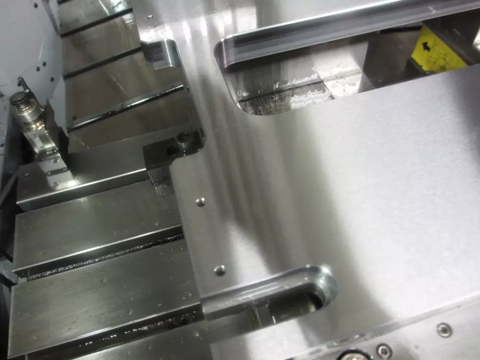 Burrless chamfering of machine tool component